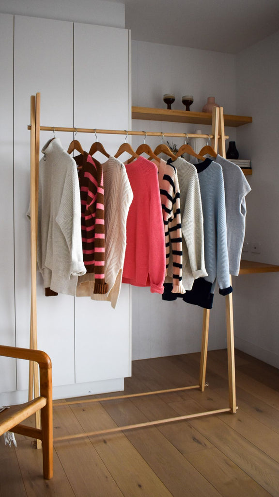 sports luxe knitwear hanging on a rail