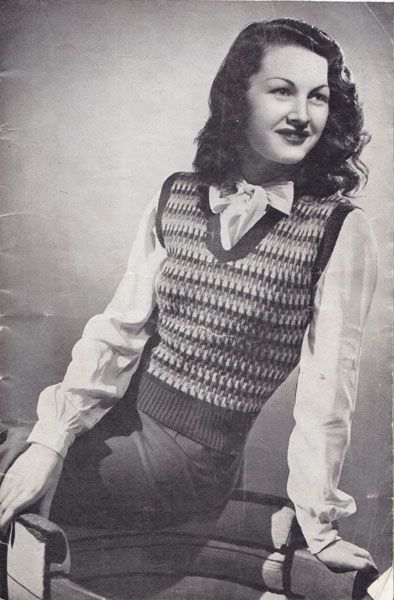 A model from the past wearing a knitted vest