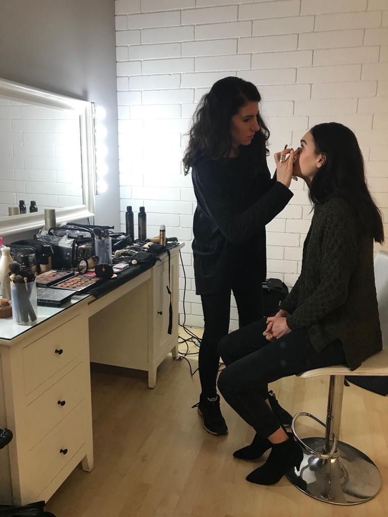 Make up artist preps a Maxted model