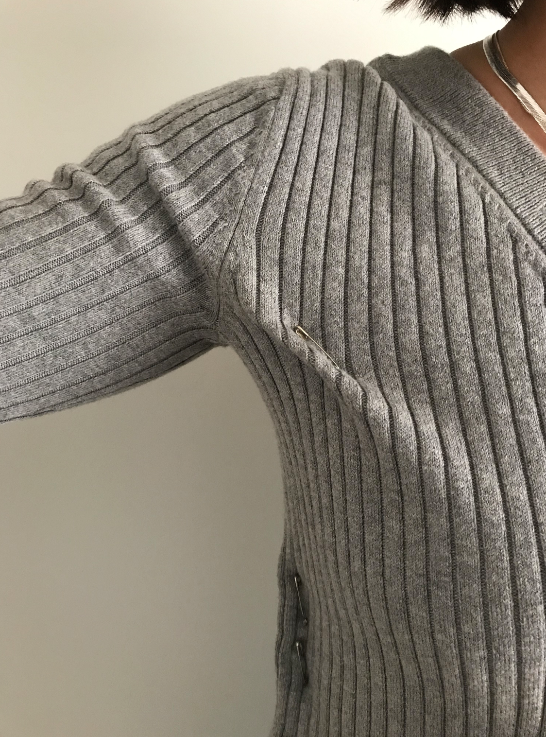 A close up of a grey maxted knit