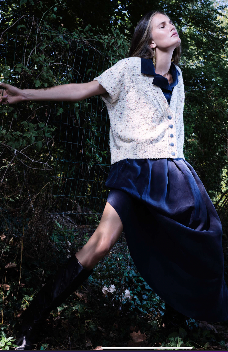 A model wearing a knitted vest