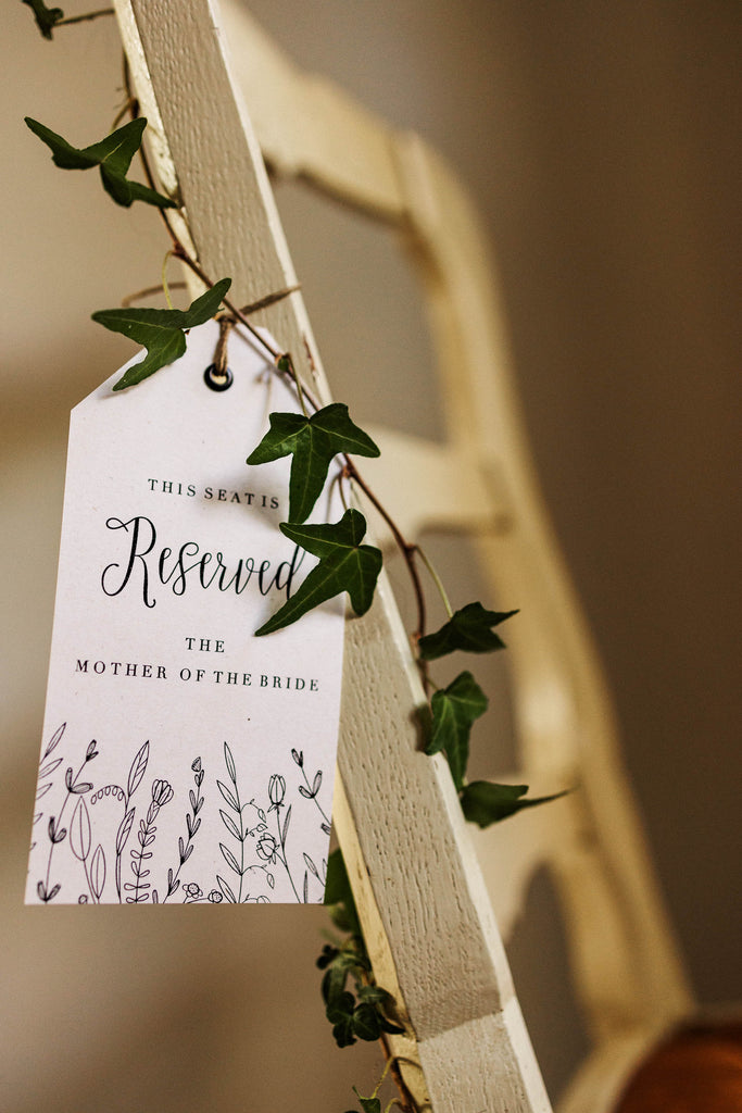 wild flower reserved tags for wedding ceremony chairs