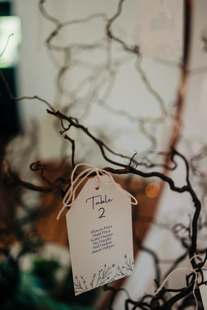 table plan hanging on willow branches