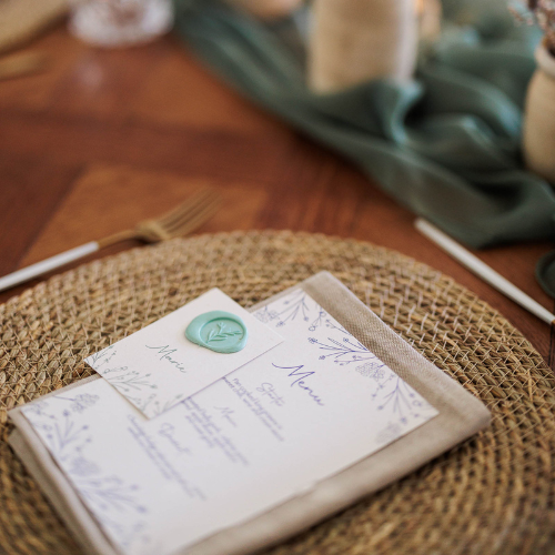 whimiscal menu and place cards with sage green wax seal