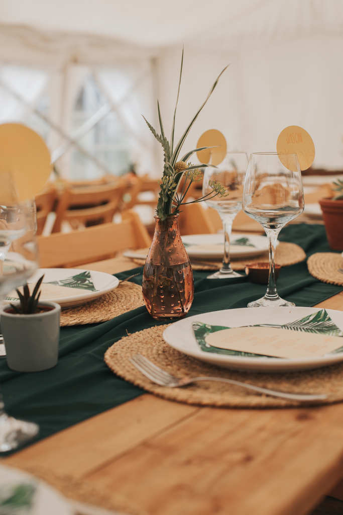 amber coloured vases on wedding table tropical theme