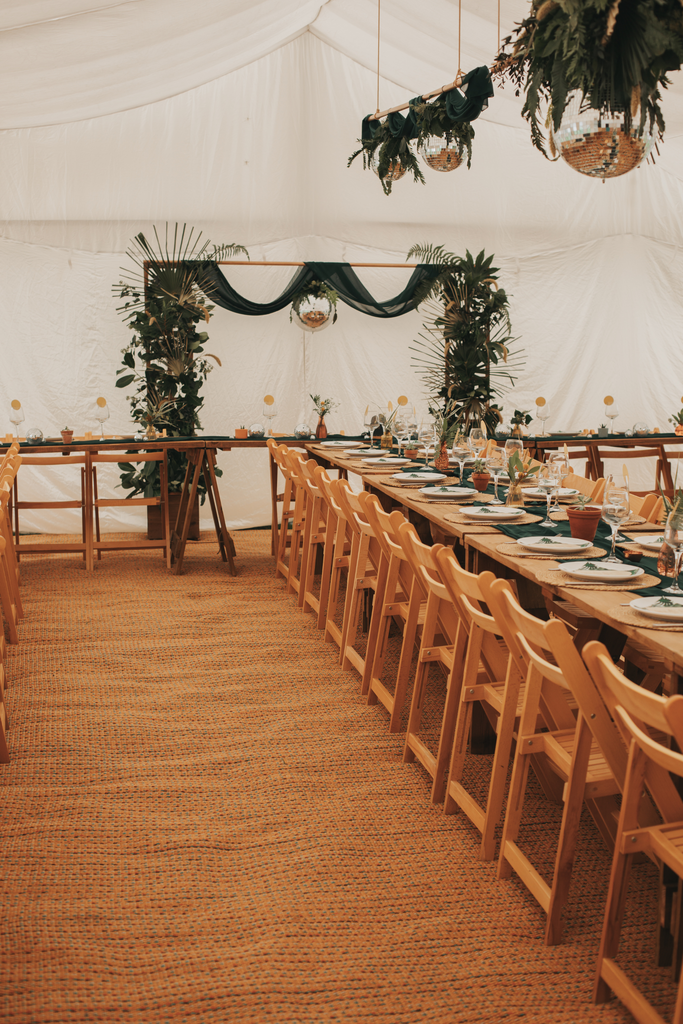 disco balls hanging from the ceiling in a marquee