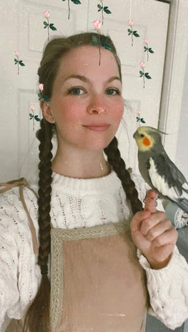 Cottage core influencer Jordan with bird