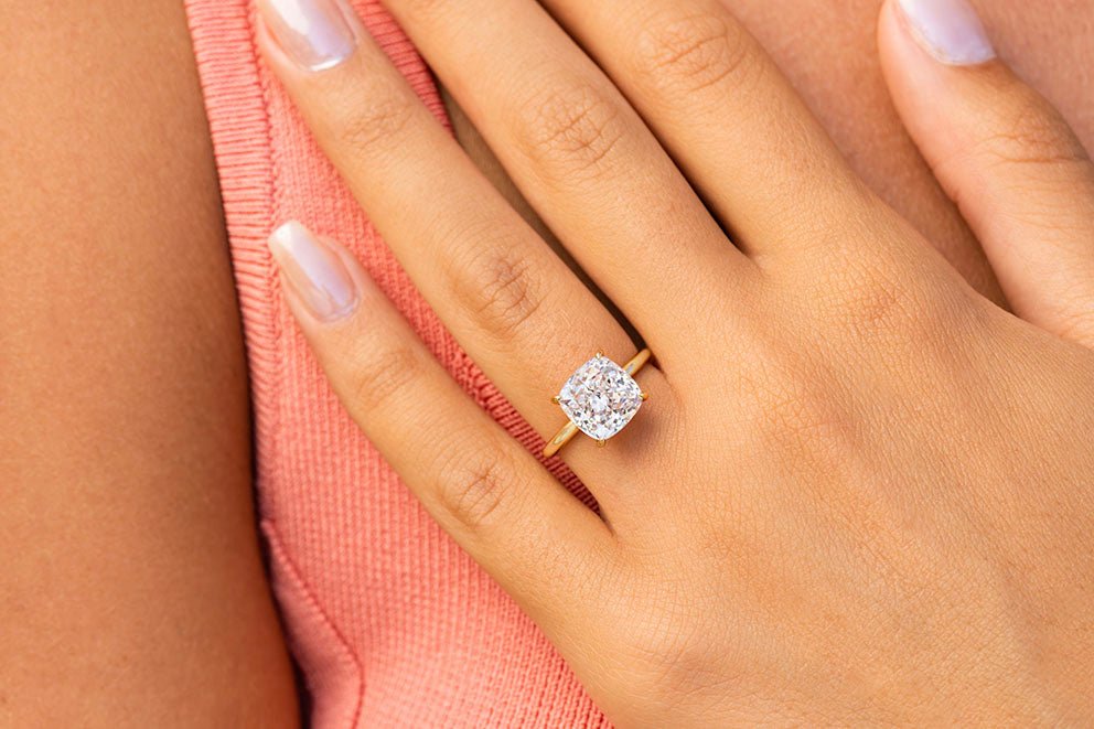 gold solitaire cushion cut engagement ring