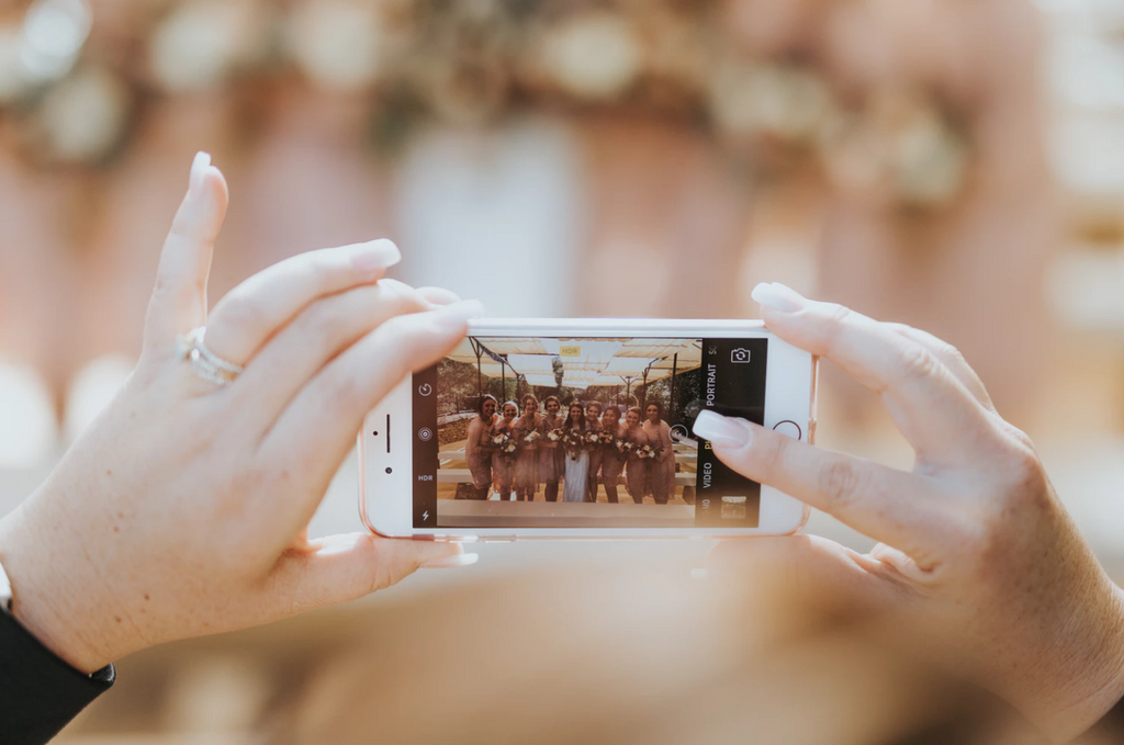 Woman taking photo on phone