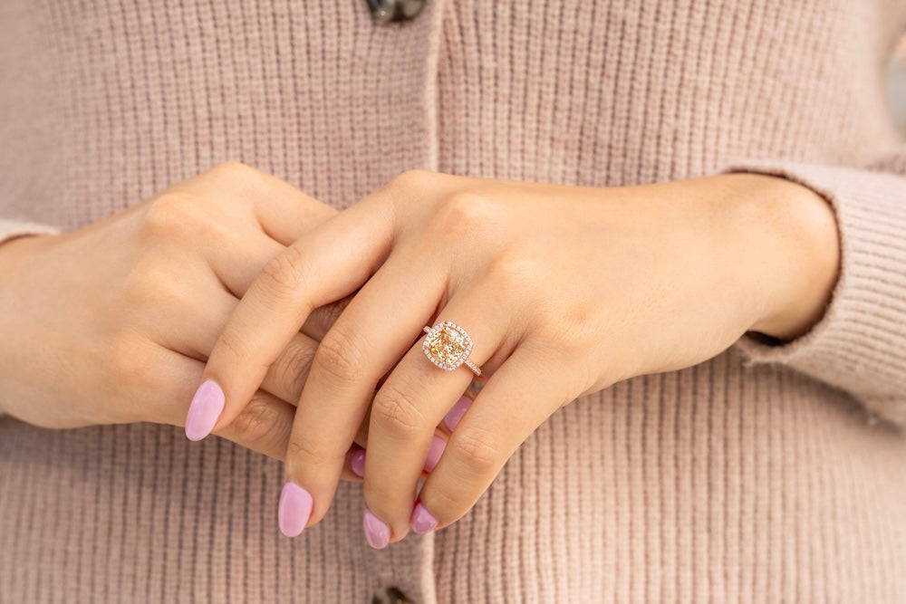 halo cushion engagement ring with three carat simulated morganite stone