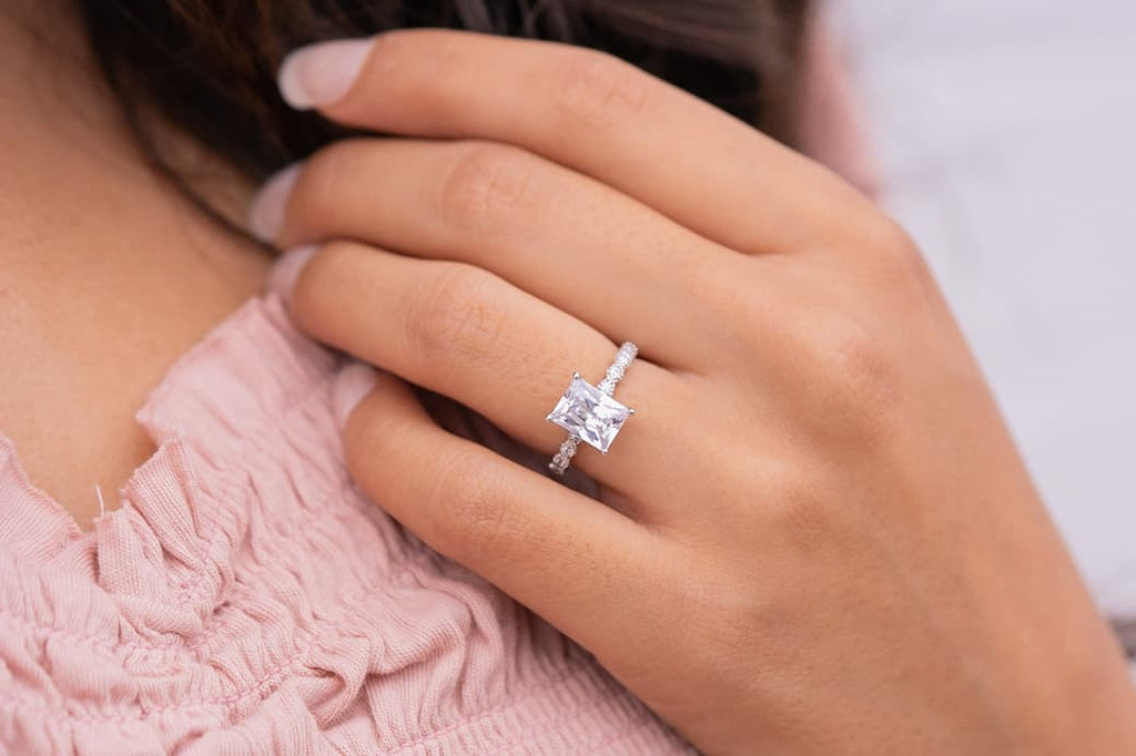 Woman's left hand wearing The Alexandria on ring finger