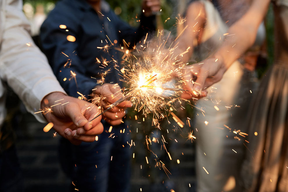 hands holding sparklers