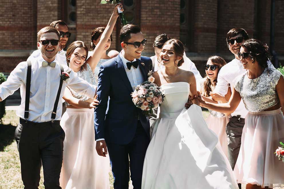 newlywed couple bridesmaids groomsmen