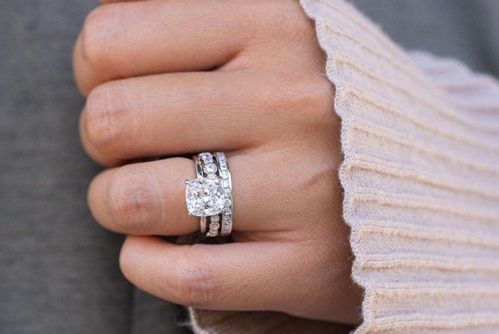 silver wedding rings on hand