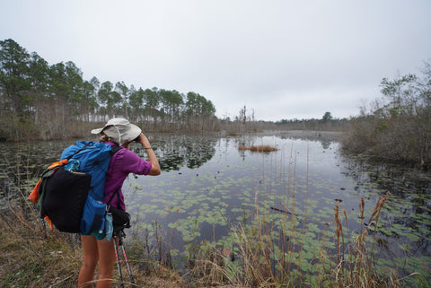 Hikerlore woman hiking with The Tinkle Belle