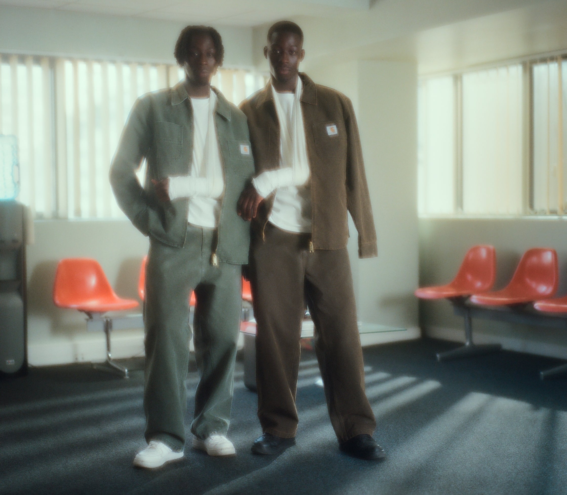 Models in waiting room wearing Carhartt WIP Garen Shirt Jackets