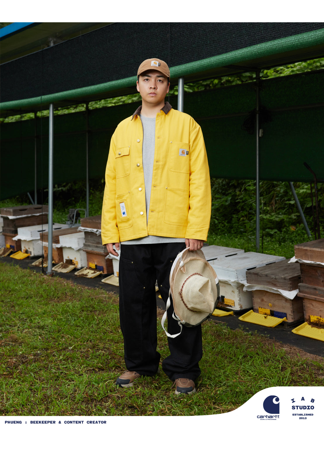 Phueng wearing an IAB Studios x Carhartt WIP OG Michigan Chore Coat