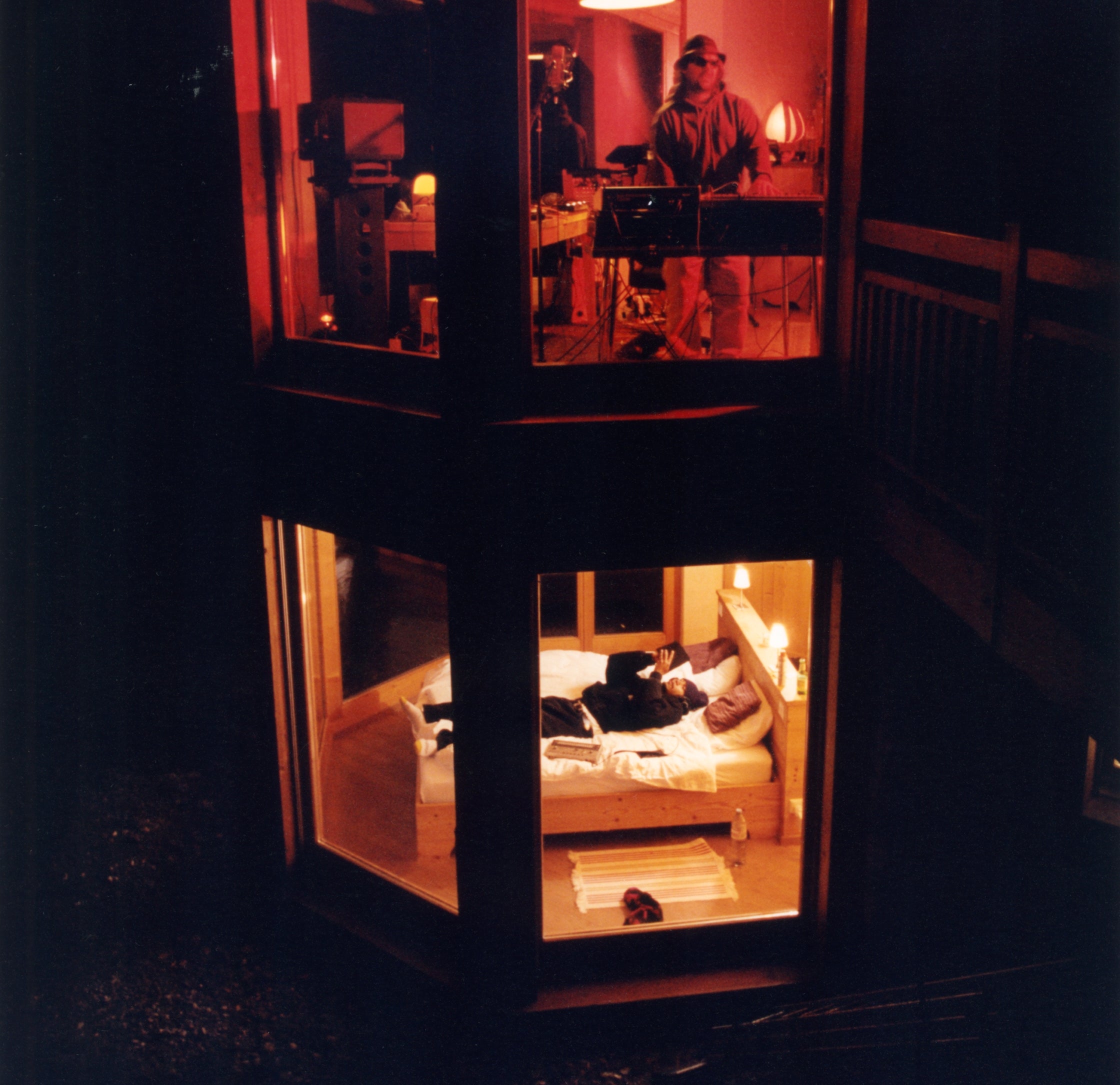 Two floor cabin with a music studio on the top floor, and Wesley Joseph laying on the bottom floor.