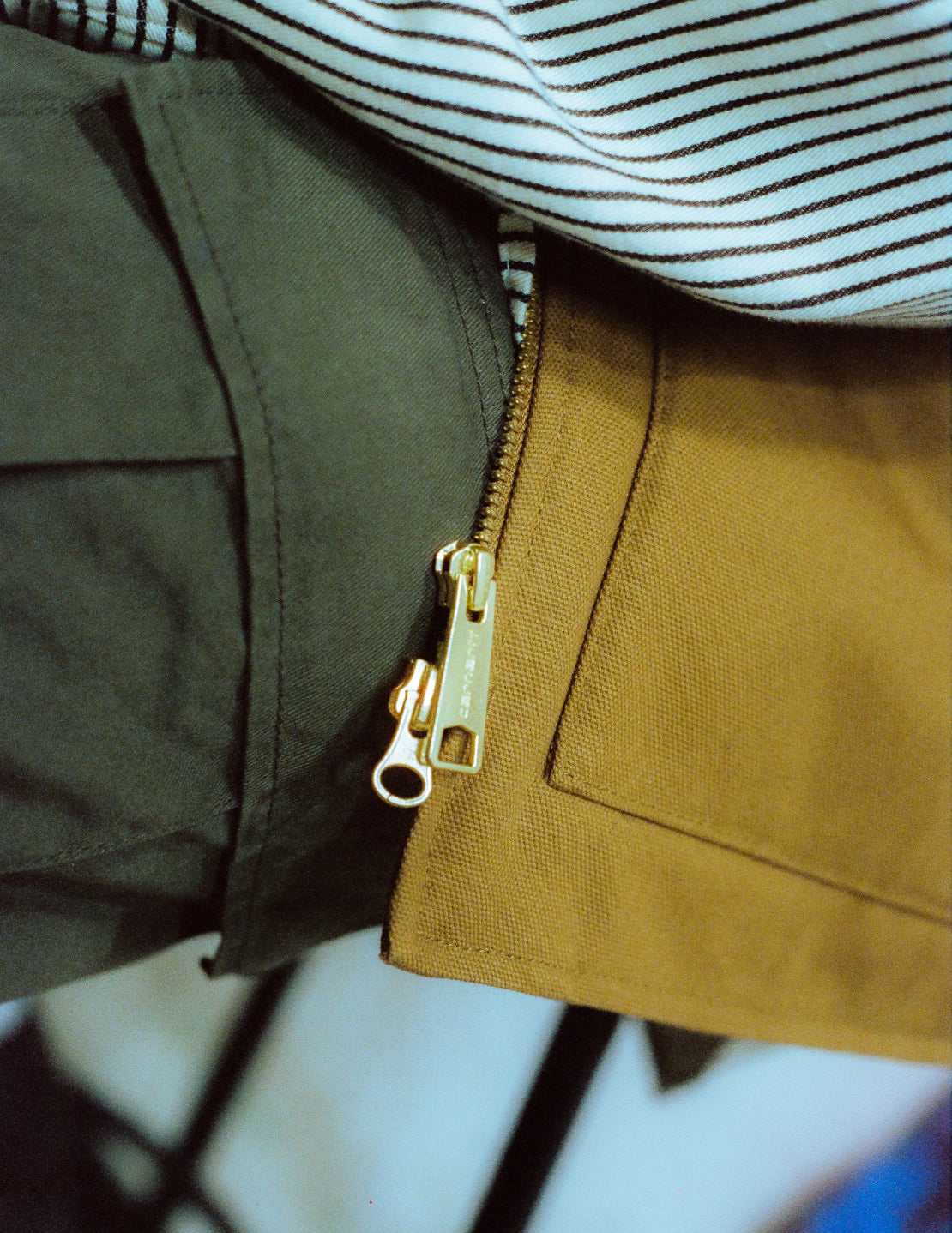 Close up of Carhartt WIP Vest zipper detail.
