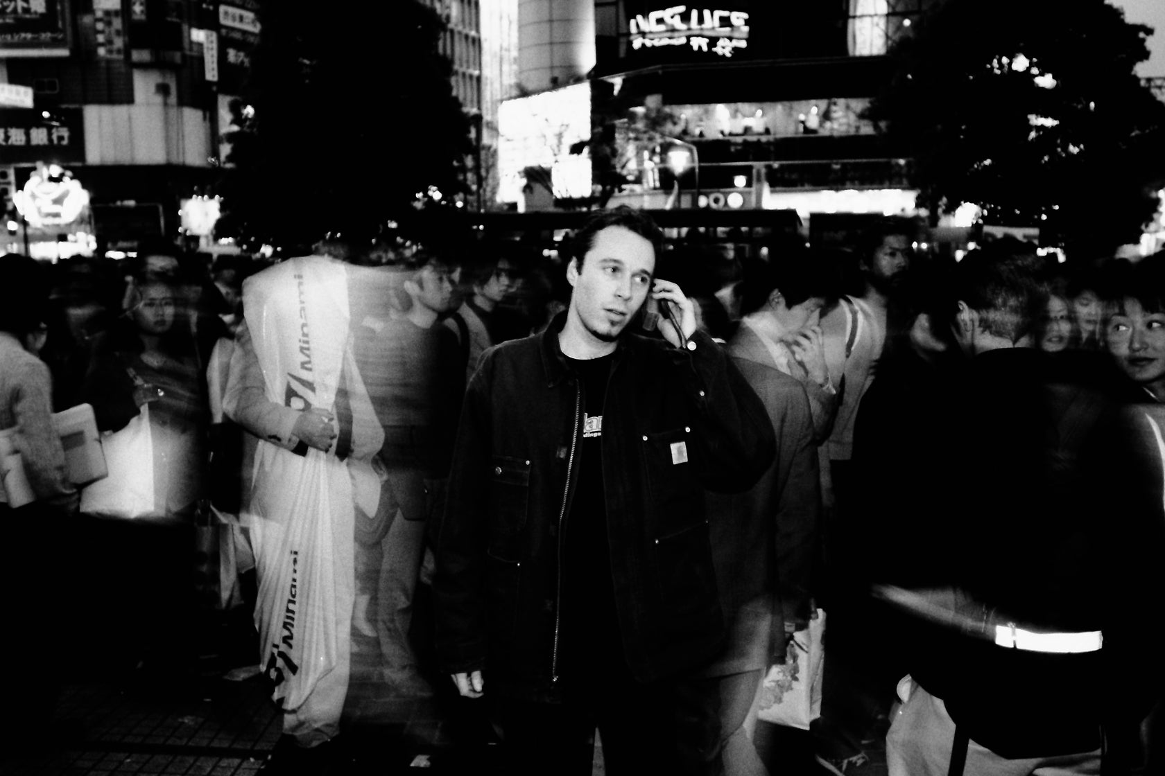 Alex from Tokyo in the middle of Shibuya Crossing wearing Carhartt WIP jacket