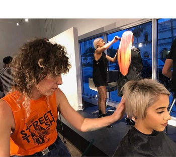 pixie cut hair stylist doing a clients pixie haircut