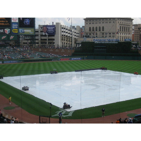 15-mil-polyethylene-baseball-field-tarp-silver-white Being Set Up In The Field