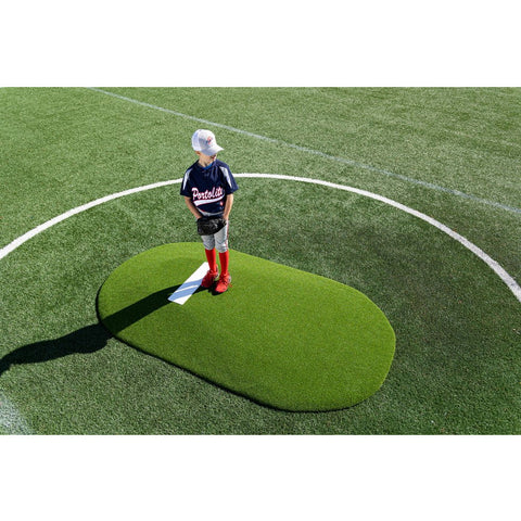 PortoLite 6" Full-Size Youth League Portable Pitching Mound pitcher standing on green mound