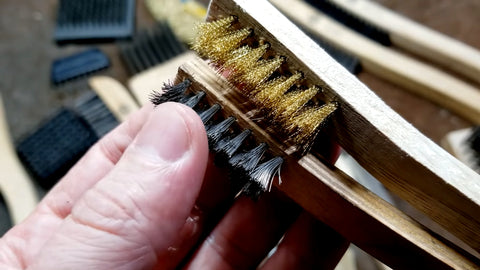 Two stove cleaning brushes with metal bristles.