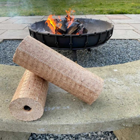 Lekto Heat Logs in front of a burning fire pit.