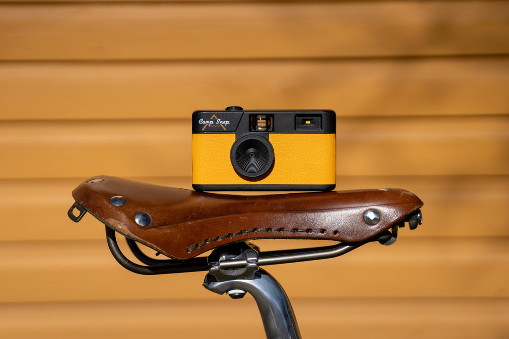 Camp snap velo orange camera yellow brown leather saddle