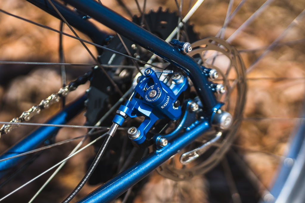 growtac post mount brakes in blue on a blue piolet frame