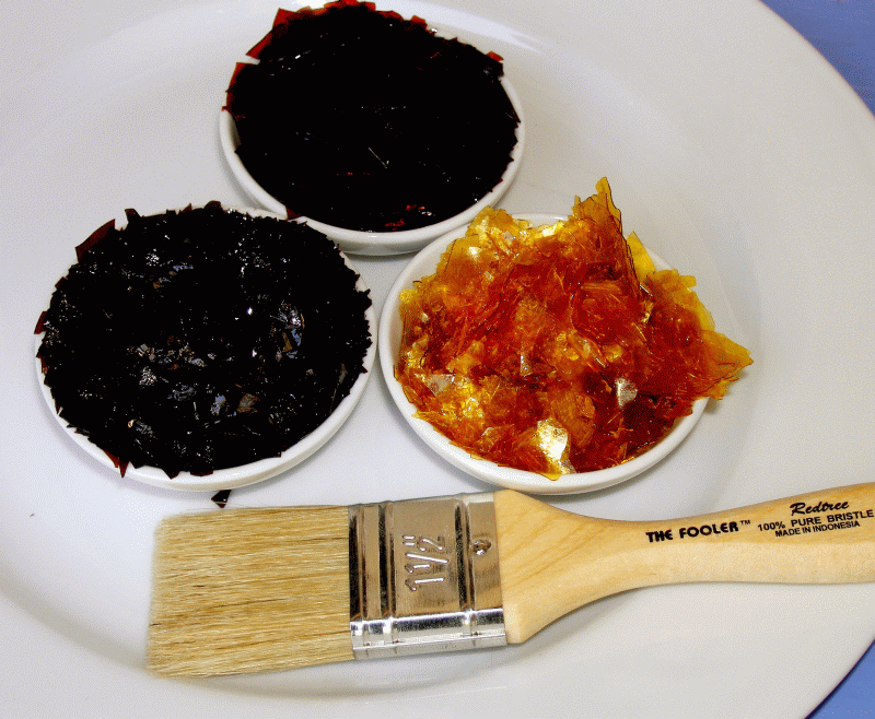 Several varieties of shellac with brush