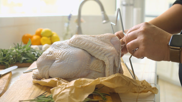 Turkey Frying Tip: Insert the star-shaped turkey lifter into the cavity so the legs are facing upward