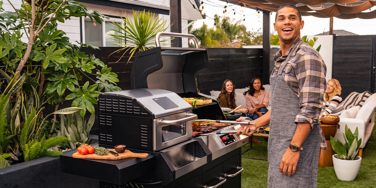 Man cooking on a Neevo smart grill