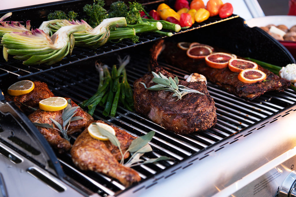 assorted foods on gas grill