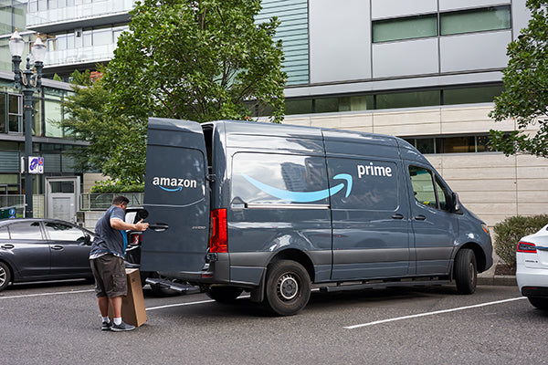 Amazon delivery driver unloading package