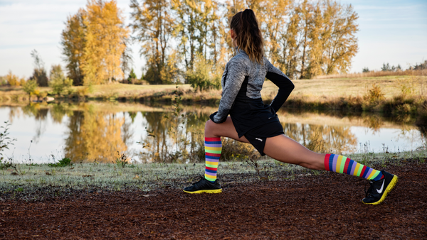 Girl stretching wearing compression socks