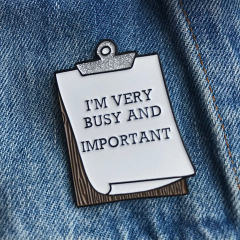 enamel pin of clipboard very busy and important