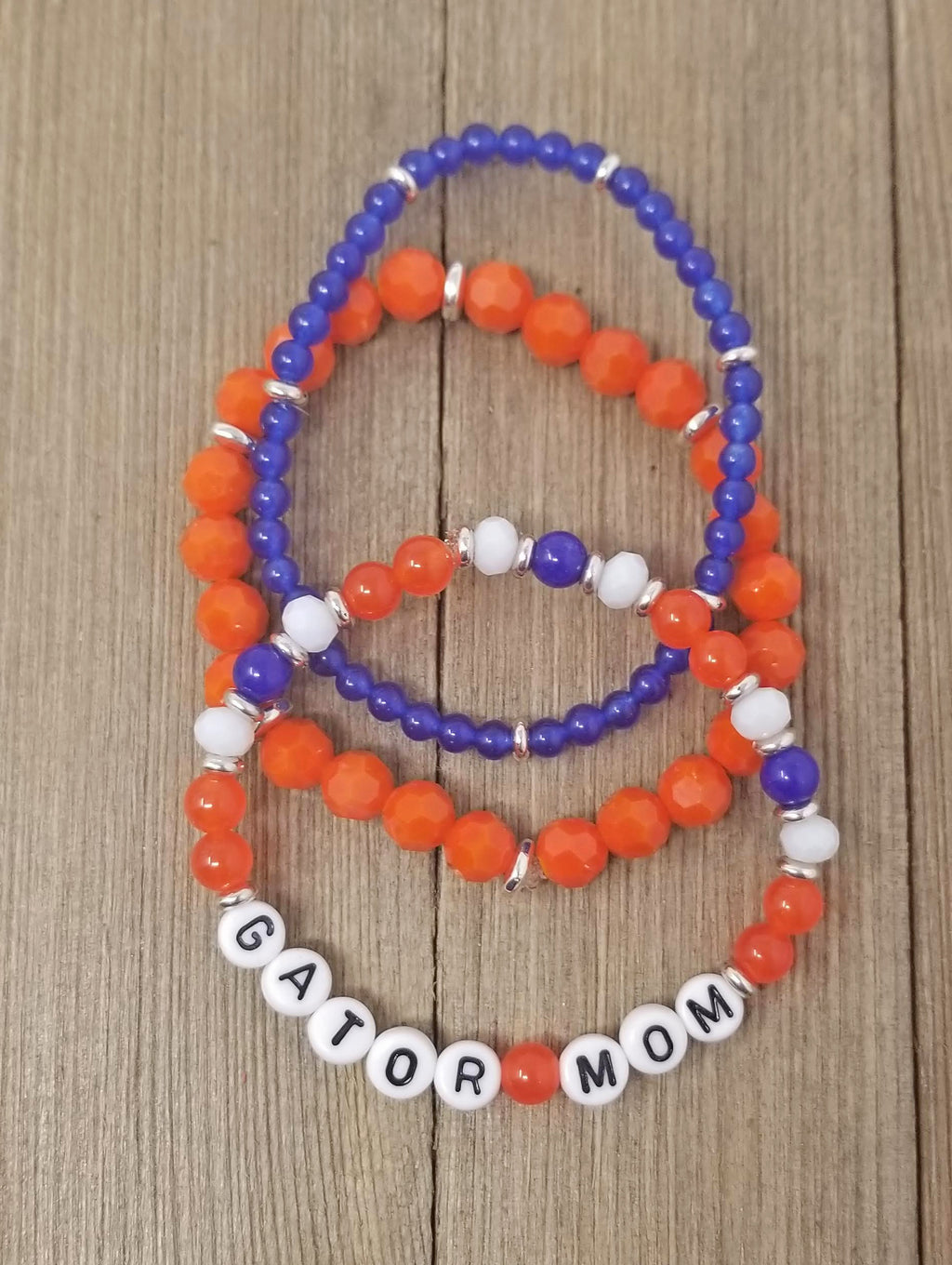 summer-friendship-bracelets-with-letter-beads-on-colourful-background - UNC  Campus Rec