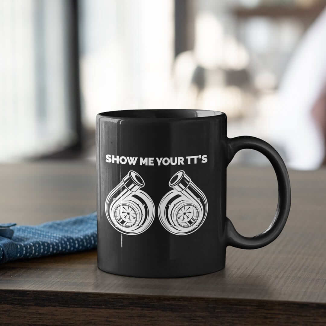 https://cdn.shopify.com/s/files/1/2200/6351/products/show-me-your-tt_s-funny-black-car-mug_-coffee-mug-for-car-guys_1600x.jpg?v=1644609552