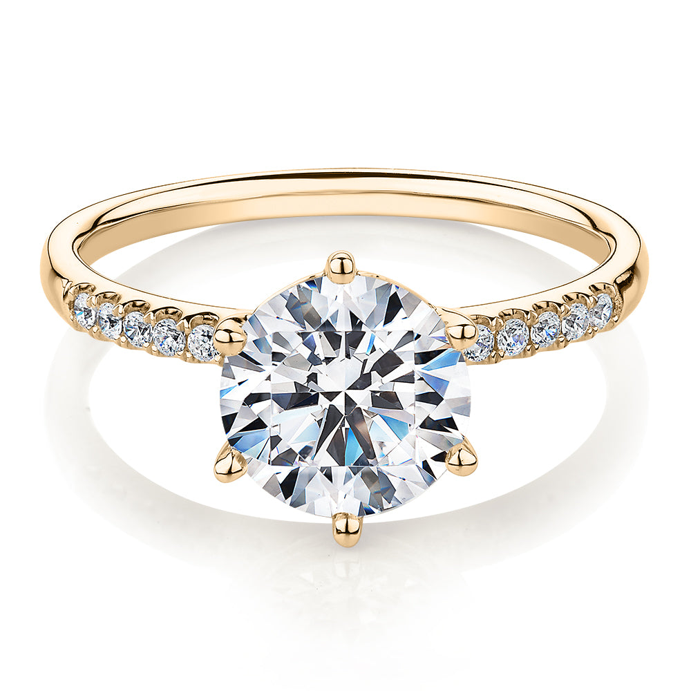 Round Brilliant shouldered engagement ring with 2.12 carats* of diamond simulants in 14 carat yellow gold