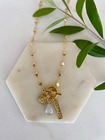 DIY bohemian and popular delicate layering necklace sets in gold, popular 2021 jewelry trends celestial moon and star charm statement starry night necklace
