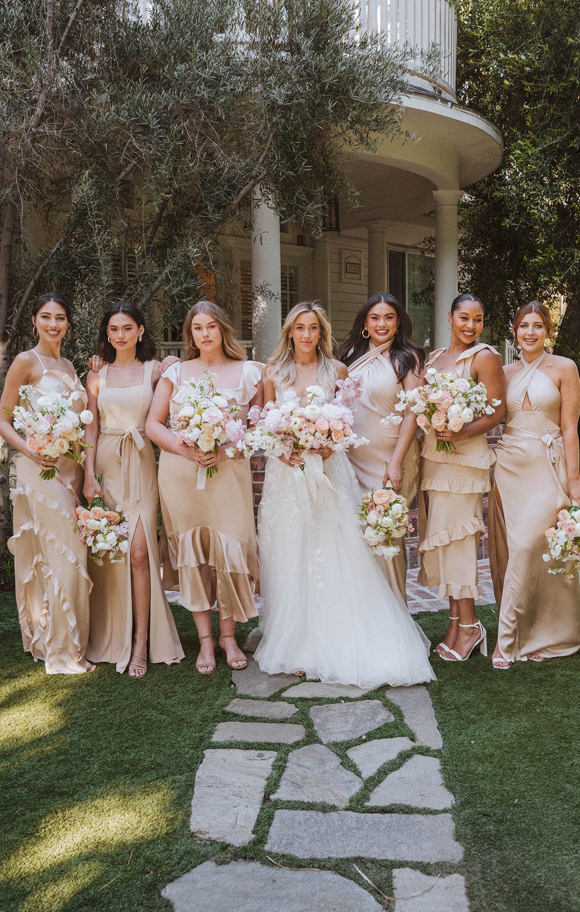 bridal party in champagne dresses