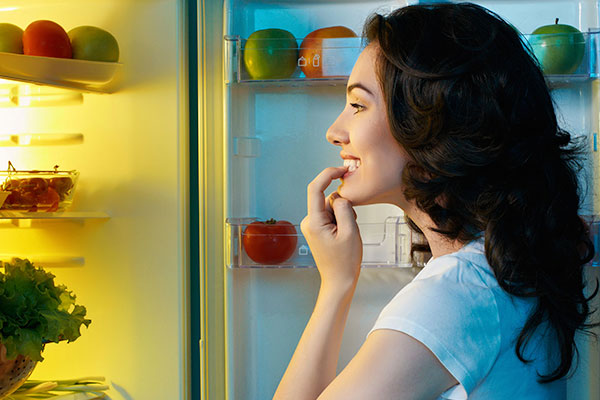 Woman Snacking At Night