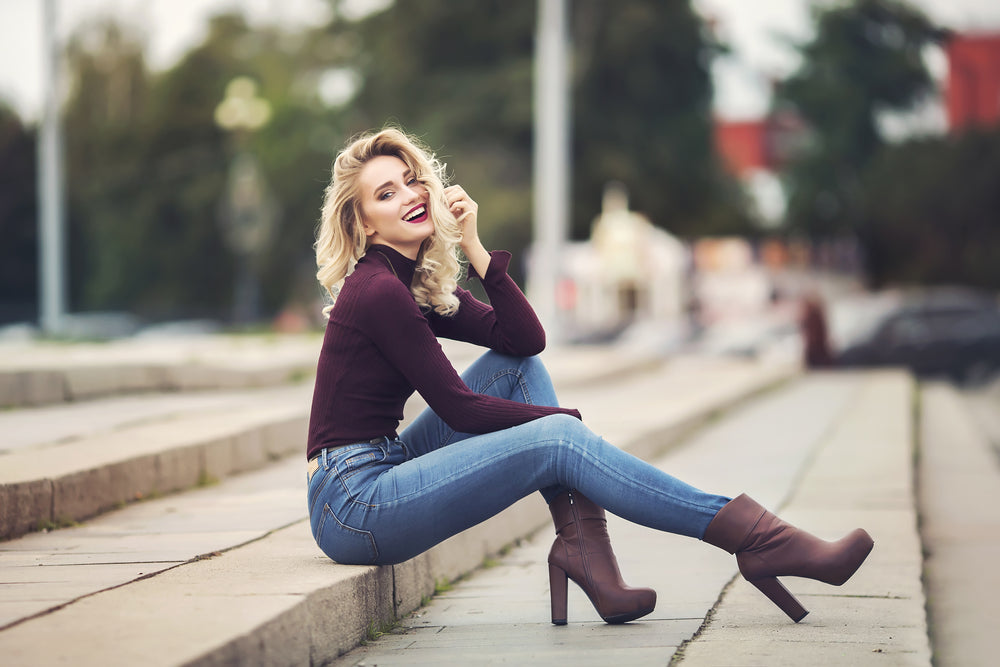 Woman sitting on steps smileing