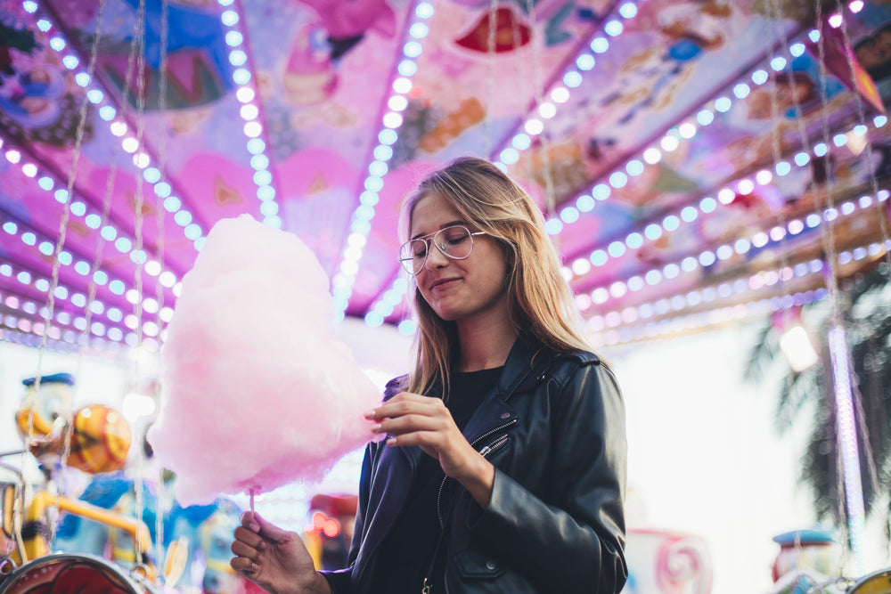 Woman with a huge ball of Cotton candy