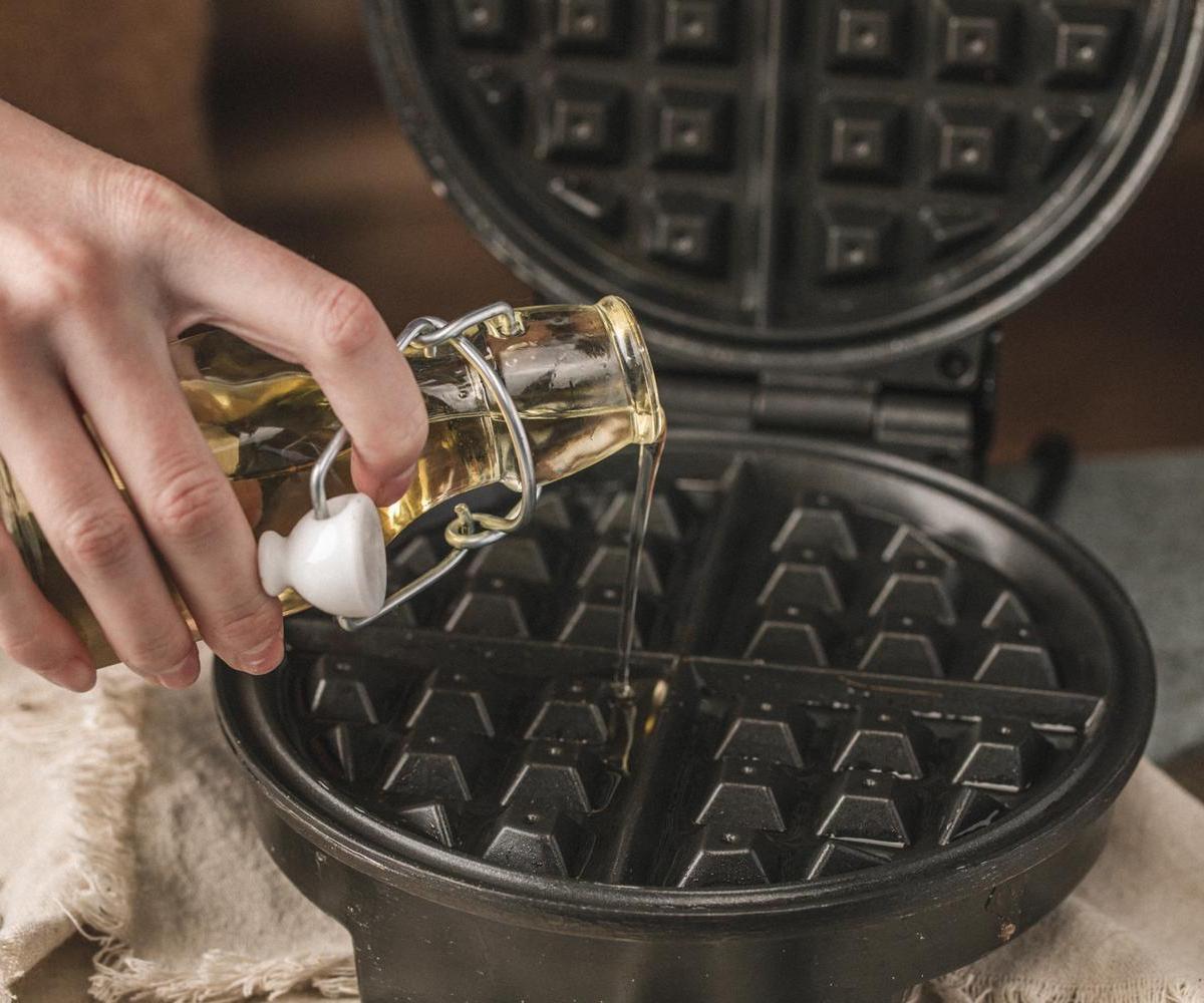 Cleaning your waffle iron tip: use a few drops of oil for those stubborn waffle bits.