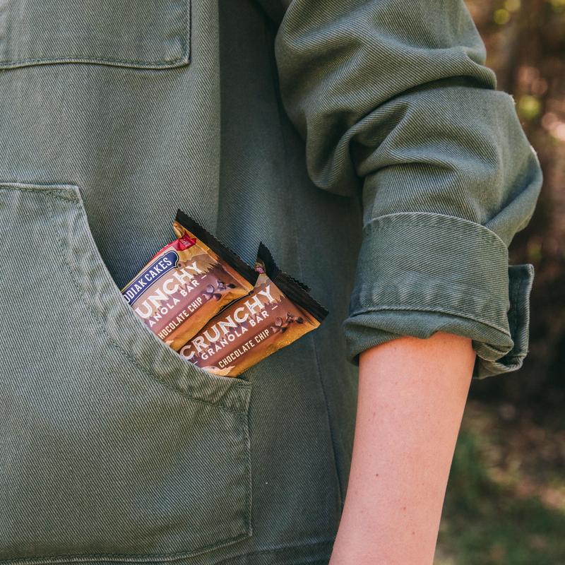 two kodiak cakes granola crunch bars in a pocket