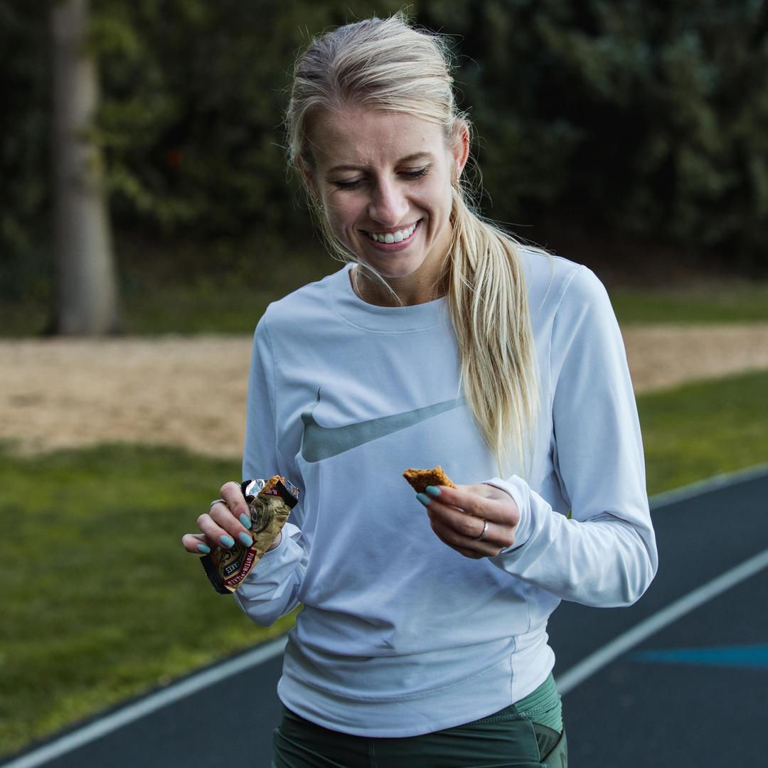 Karrissa eating a kodiak crunchy bar