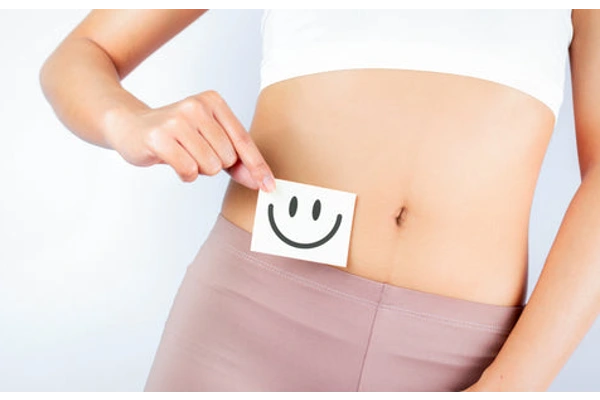 Torso shot of a woman in pink yoga pants